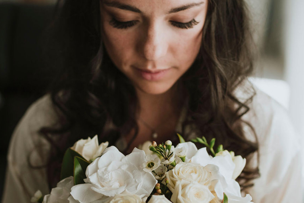 A bride with her bouquet before a religious ceremony in Venice